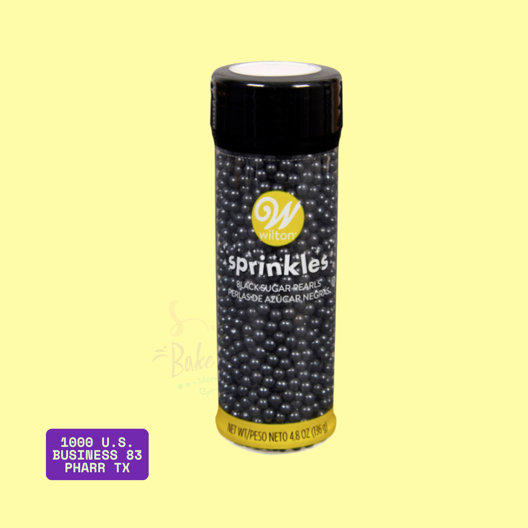 Wilton Black Sugar Pearls in a 4.8 oz (136 g) clear bottle with black cap and yellow label. Edible black pearl-shaped sprinkles ideal for cake and cupcake decorating. Sold at Bake A Cake, 1000 U.S. Business 83, Pharr, TX.