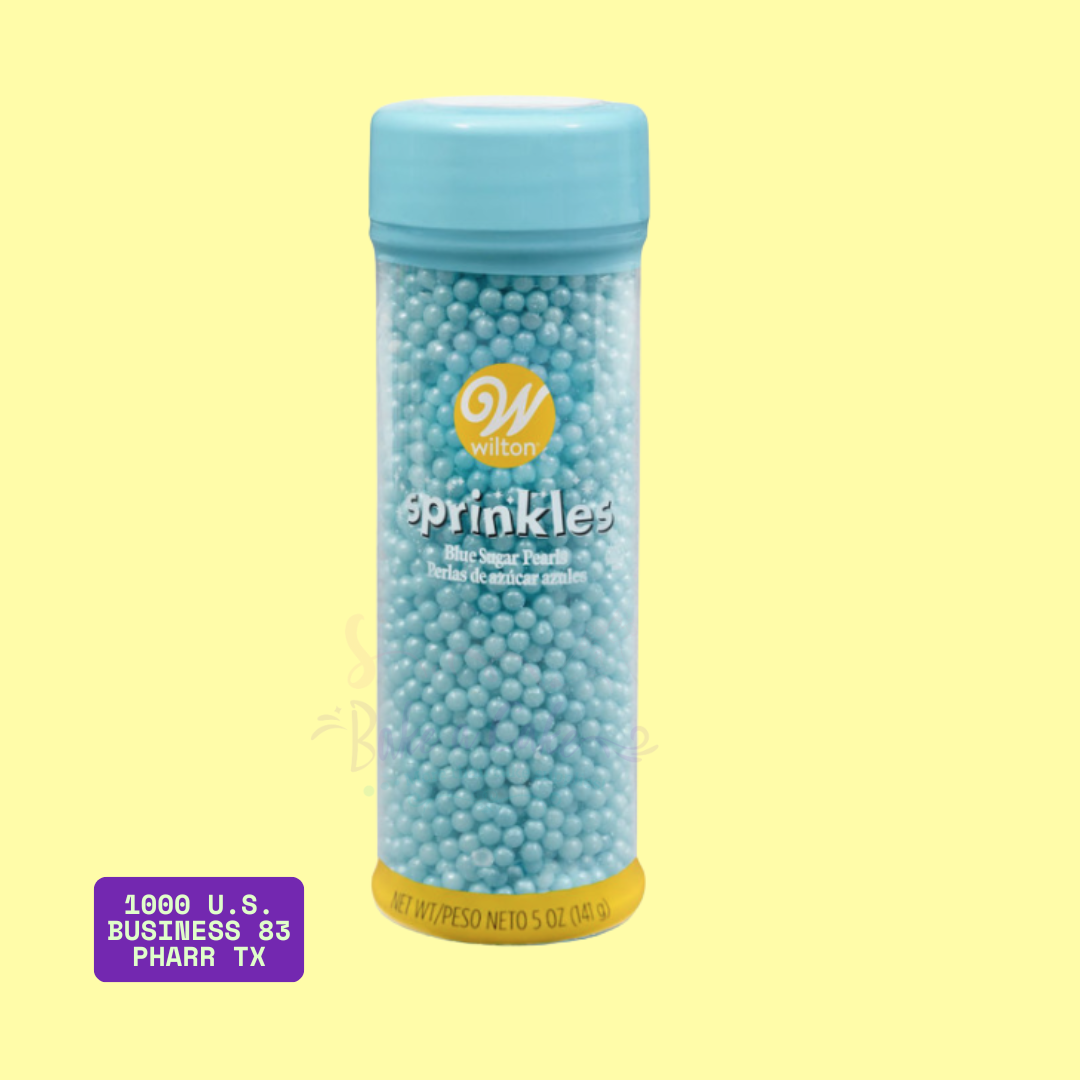 Wilton blue sugar pearls in 5 oz bottle with blue lid, used for decorating cakes, cupcakes, and cookies. Edible sprinkles available at Bake A Cake in Pharr, TX.