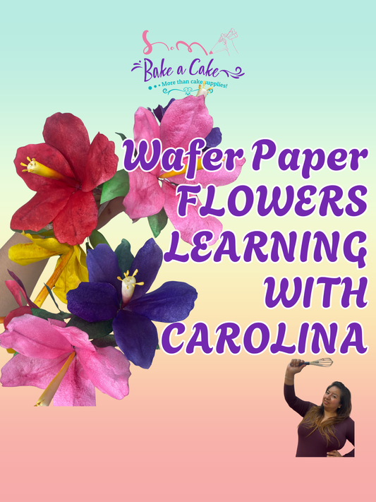 Colorful wafer paper flowers in pink, red, and purple with green leaves, handmade during the Wafer Paper Flowers Learning with Carolina class at Bake a Cake